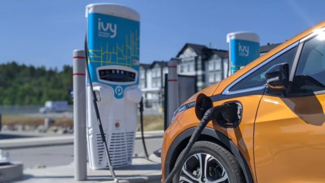 Metallic Gold Chevy Volt EV charging at commercial EVSE. 